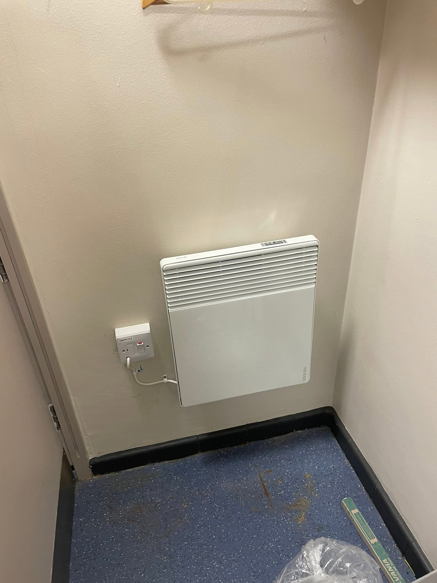 Office wall heater plugged into a switched socket